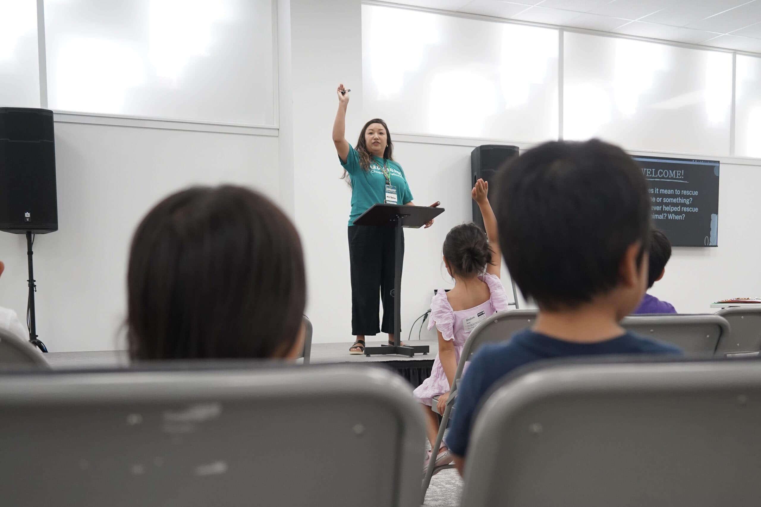 A teacher leading a Crossroads lesson in the kids classroom