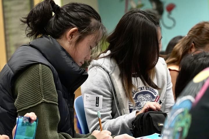 Metro Next youth group student taking notes