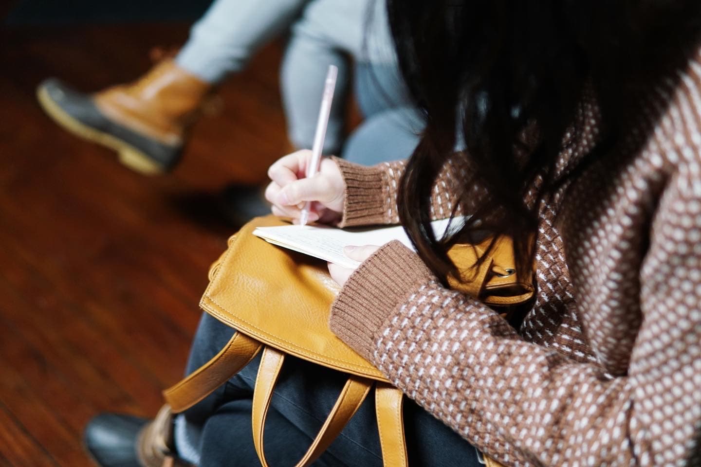 A person writing in a book